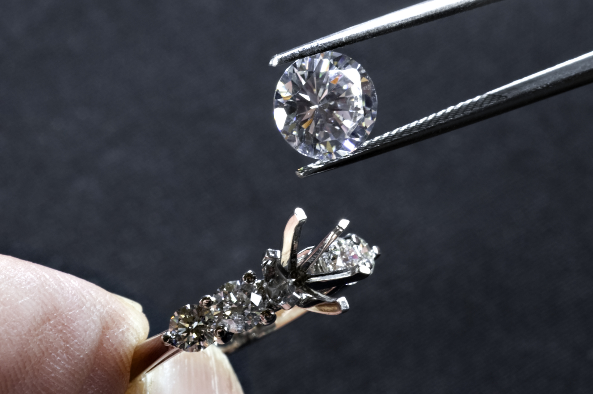 Jeweller setting a diamond
